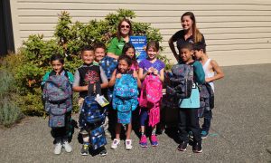 Happy Recipients from Douglas School Langley School along with staff members from Maple Leaf Self Storage Langley and Office Move Pro